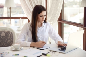 front view young brunette businesswoman which is working laptop writing something down 8353 10535 Administrative Assistant